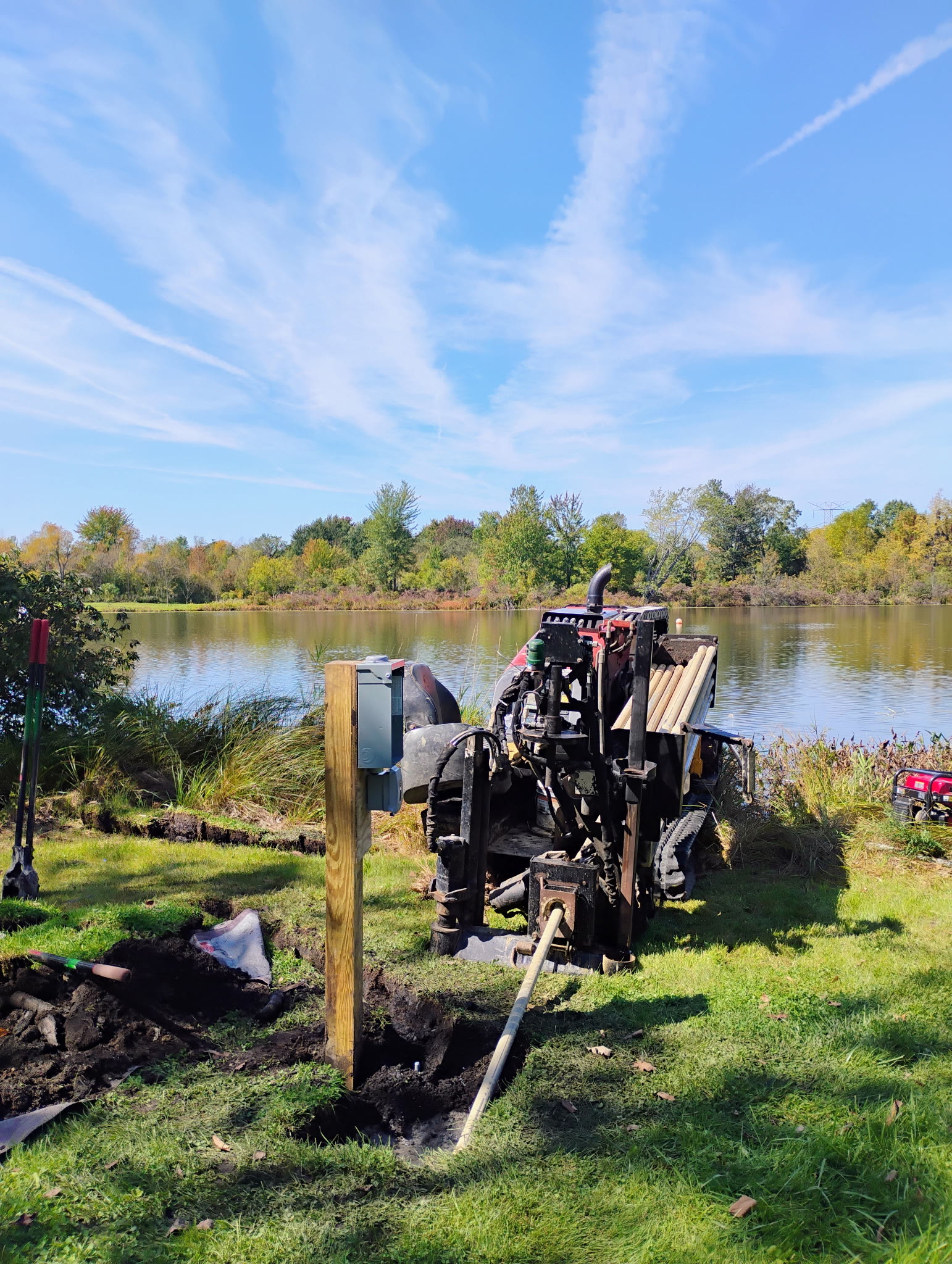 Directional drill completing a low-impact underground installation beside a Michigan lake